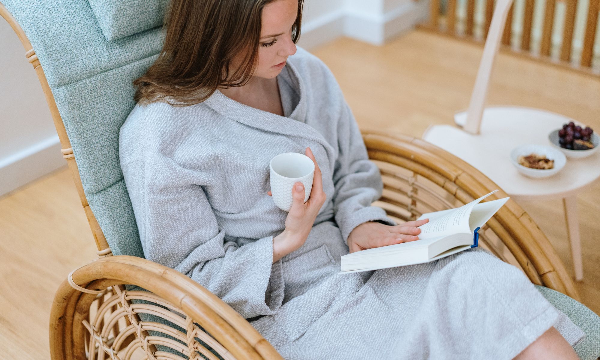 A girl sitting in St. George Care Spa reading magazine